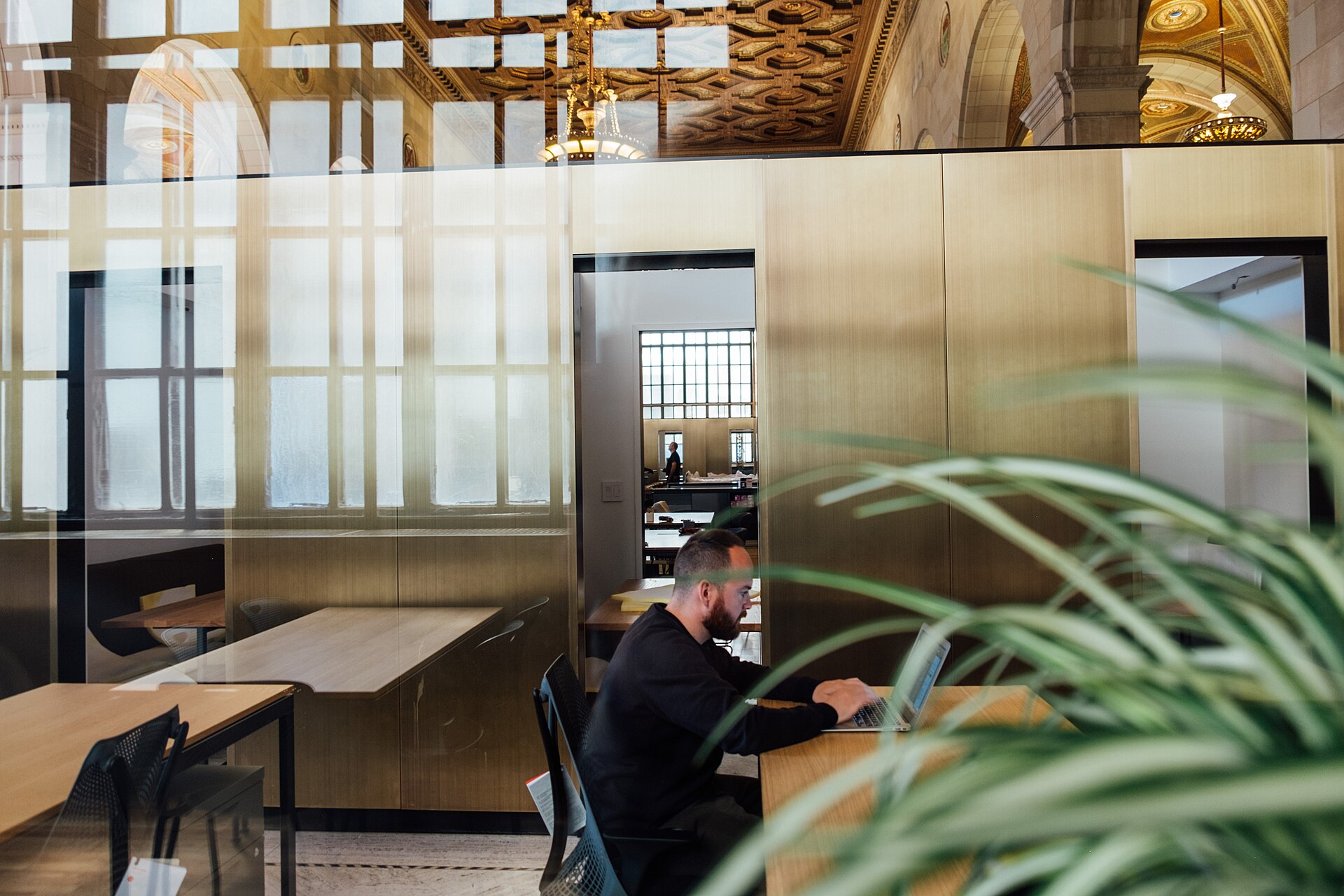 A person working in a small open-plan office